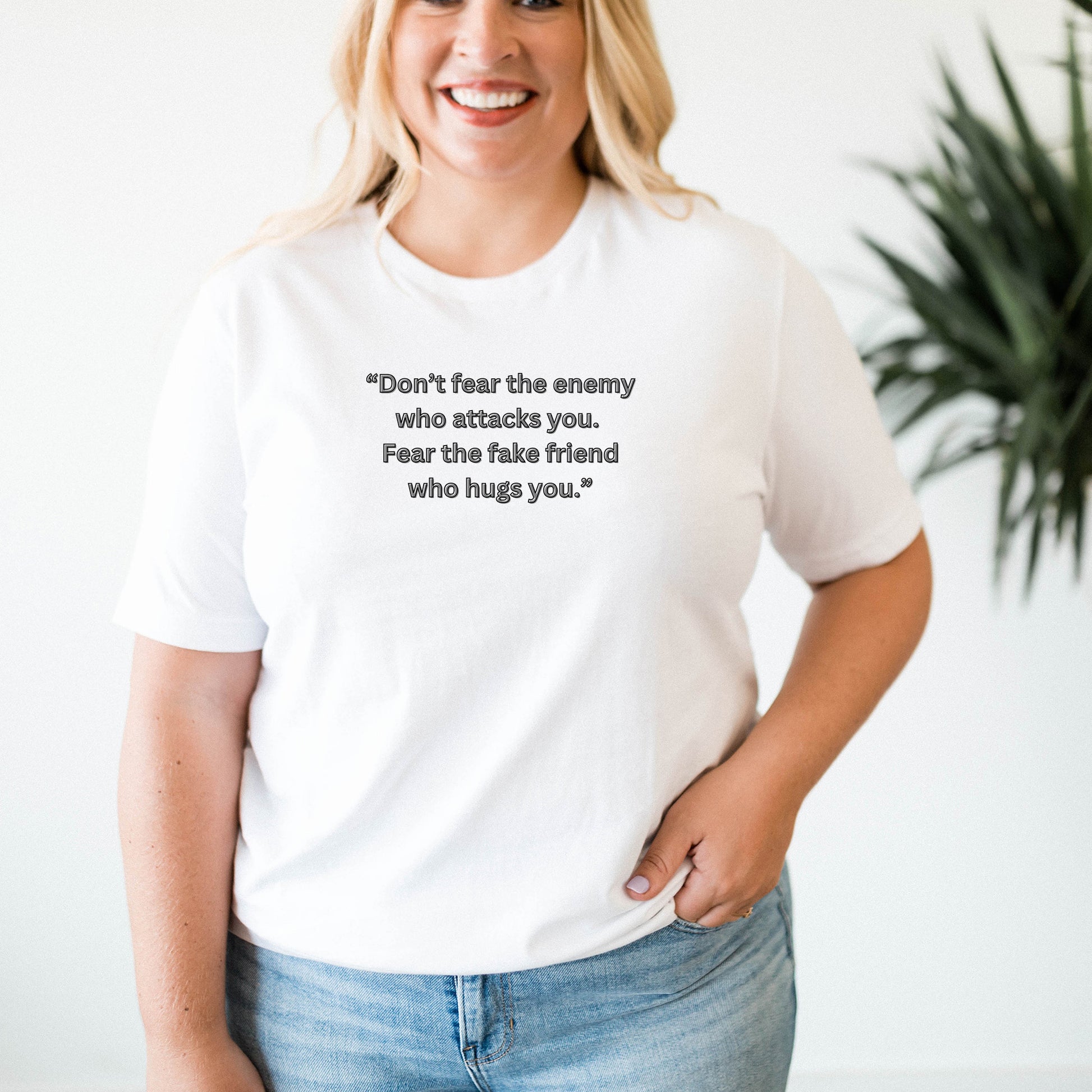 Don’t fear the enemy  who attacks you. Fear the fake friend  who hugs you.”T Shirt
